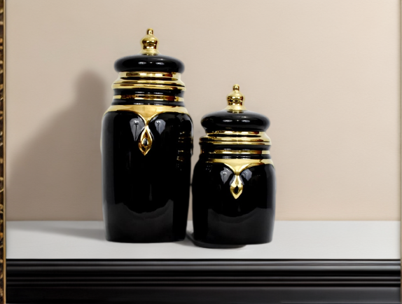 A black candy jar set placed on a white top